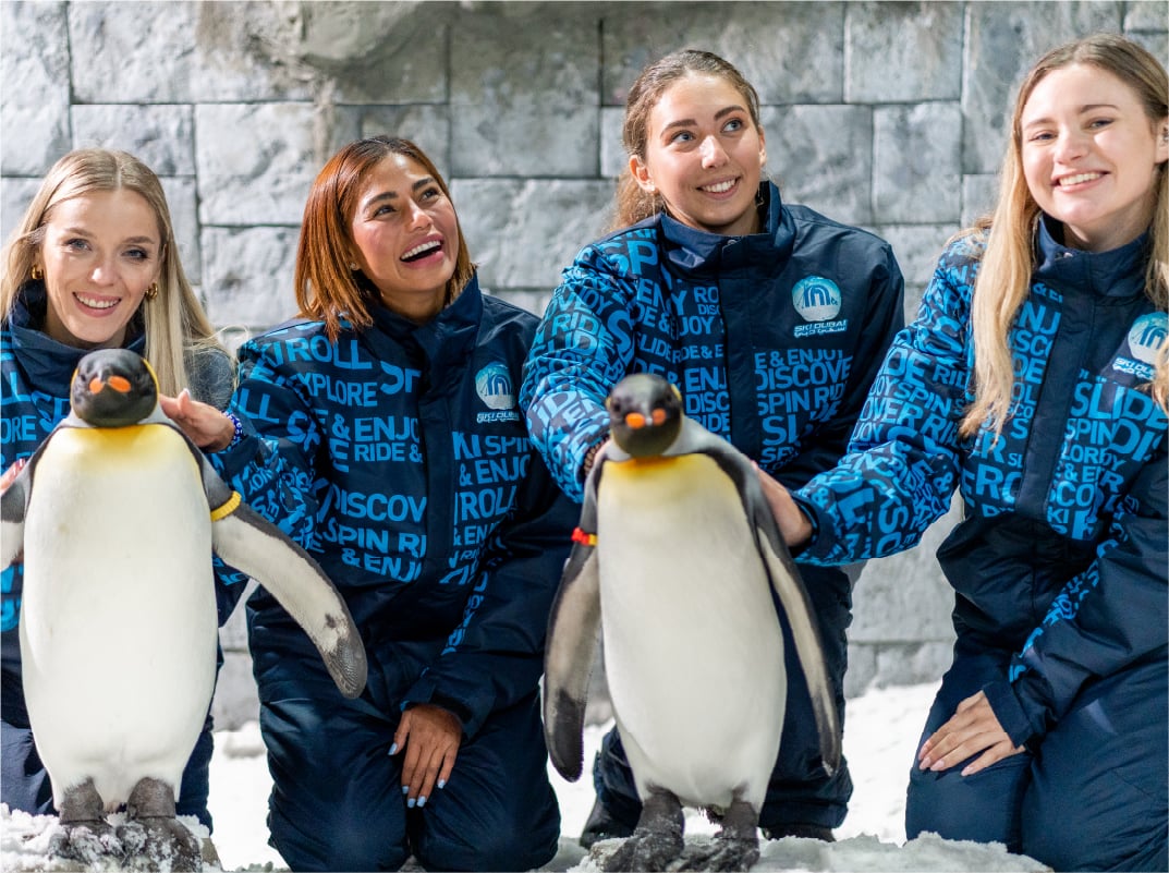 ladies-playing-with-penguins-at-ski-dubai